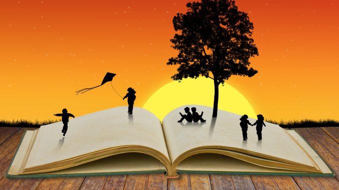 Paper cut of children play on old book